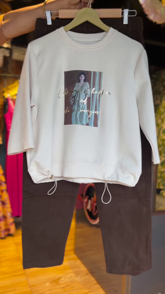 Cream Graphic Sweatshirt with Drawstring Hem & Brown Trousers – Casual Street Style Co-Ord Set for Women - Photo 1