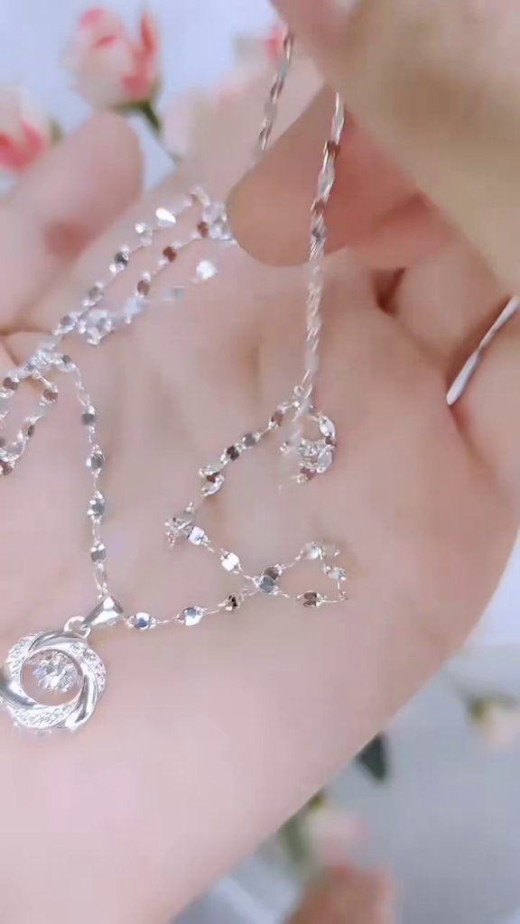 Elegant Silver Necklace with Twisted Floral Pendant – Sparkling Crystal Centerpiece - Photo 2