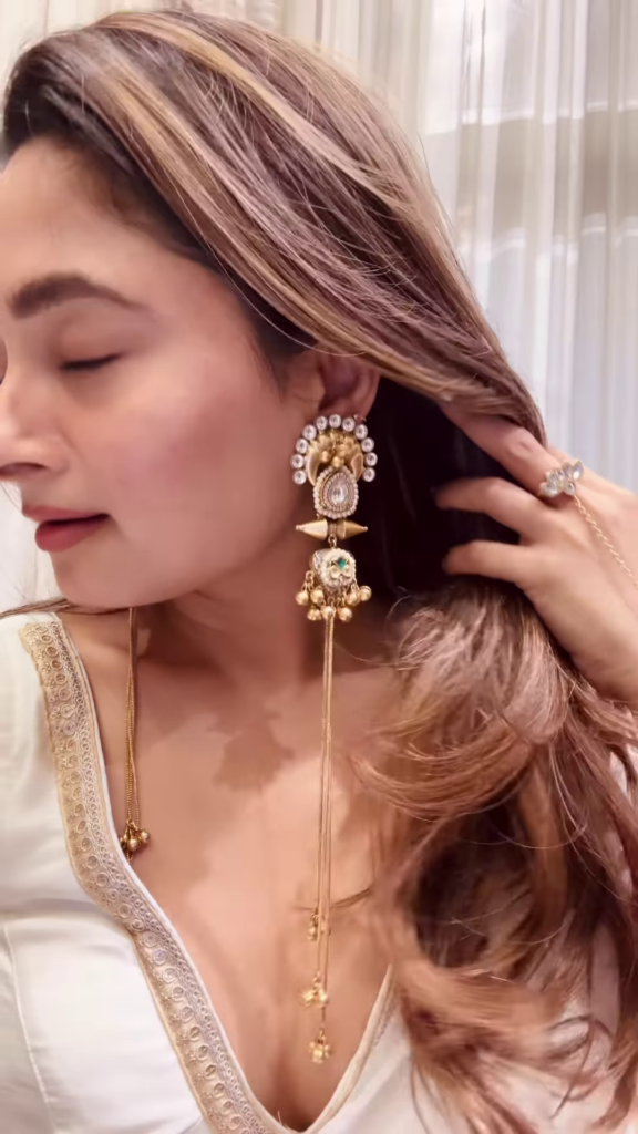 Elegant Gold-Toned Statement Earrings with Intricate Detailing and Chain Drapes - Photo 2