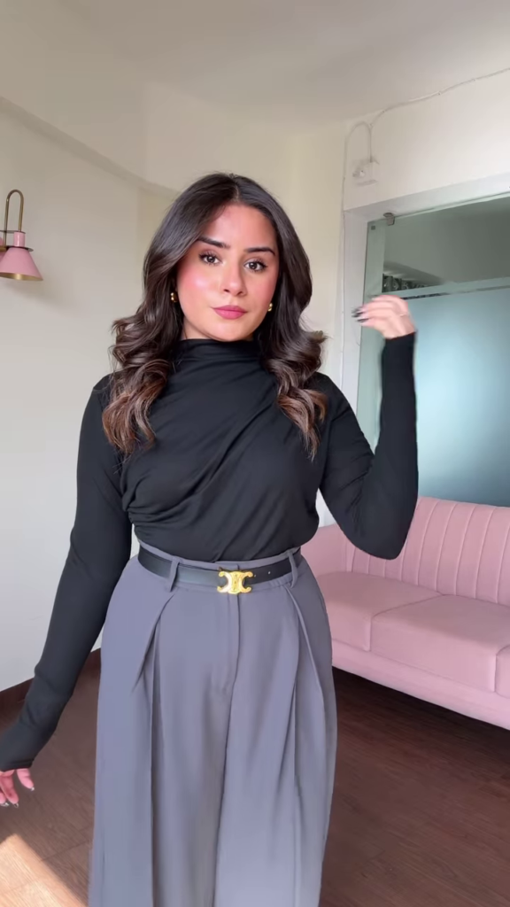 Chic Women's Outfit: Blue Mock Neck Long Sleeve Top and High-Waisted Black Wide-Leg Pants - Photo 2