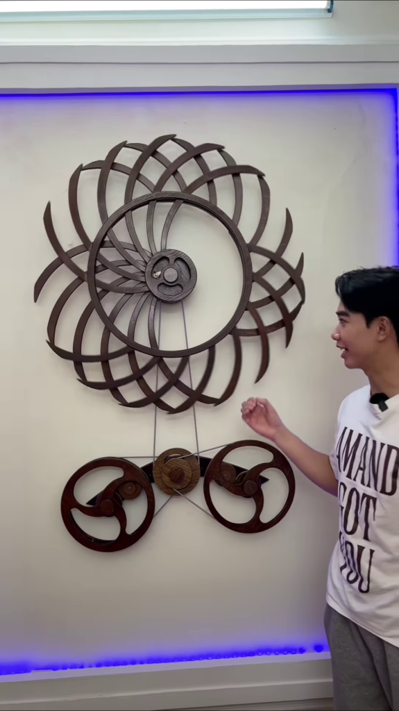 Intricate Kinetic Wall Sculpture with Moving Gears and Abstract Design - Photo 3