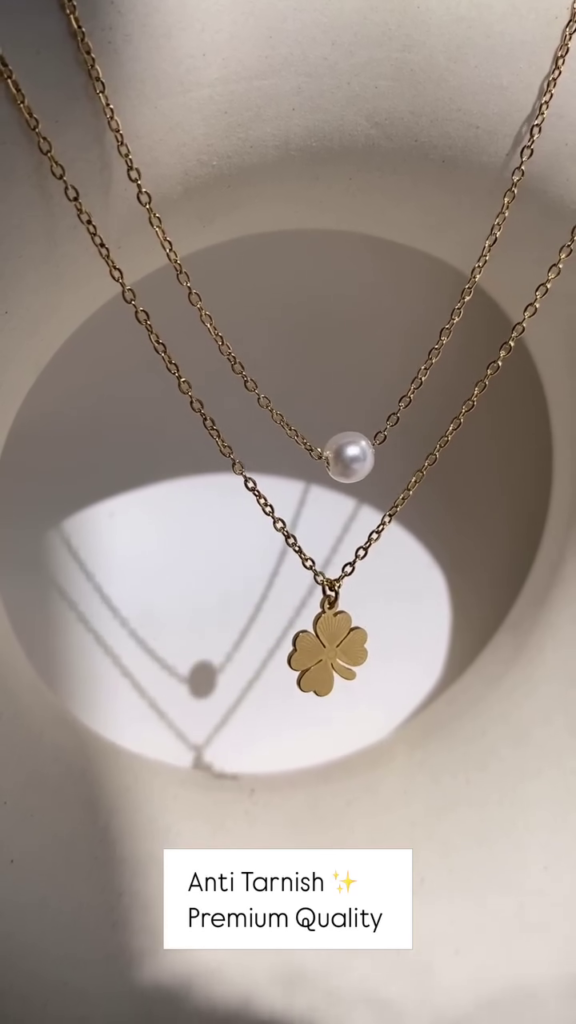 Delicate Layered Gold-Toned Necklace with Four-Leaf Clover and Pearl Pendants - Photo 1