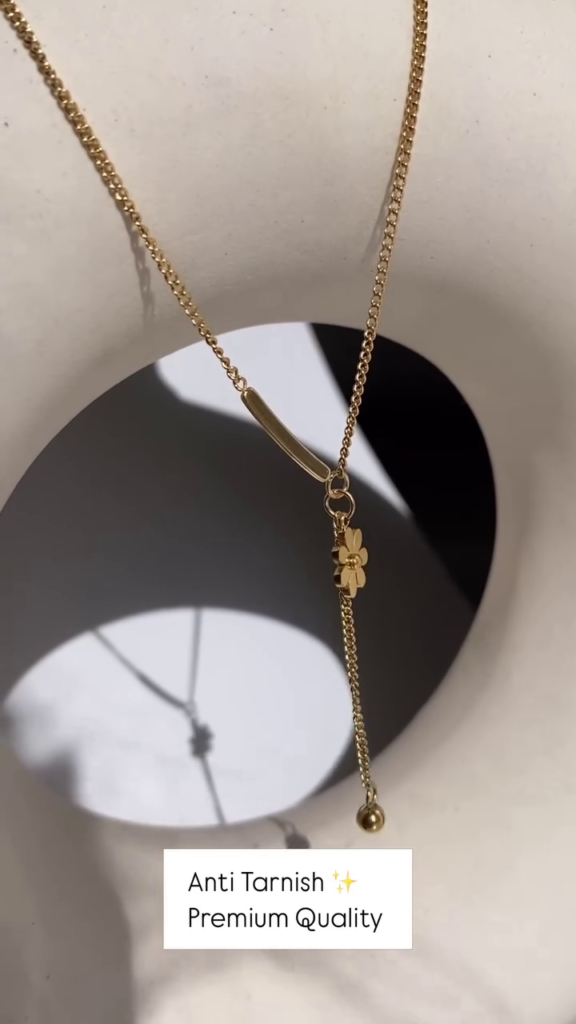 Delicate Layered Gold-Toned Necklace with Four-Leaf Clover and Pearl Pendants - Photo 2
