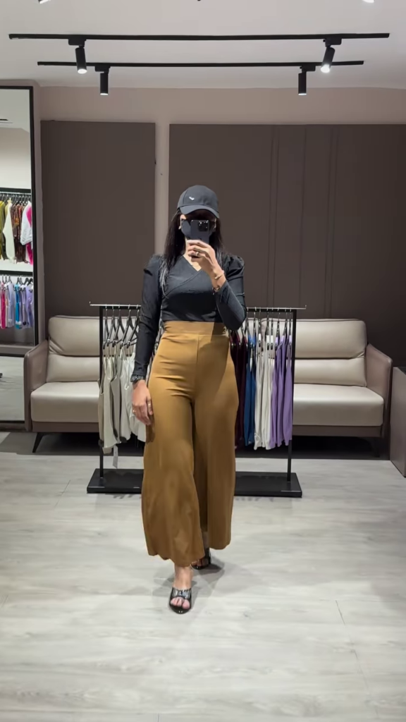 Elegant Ruched Sleeve Top with Deep V-Neck and High-Waisted Wide-Leg Pants - Photo 2