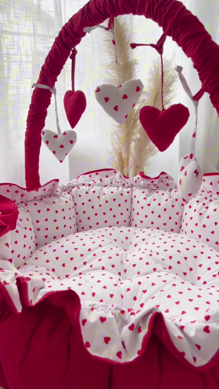 Cozy Baby Bassinet with Heart Print and Hanging Heart Mobiles