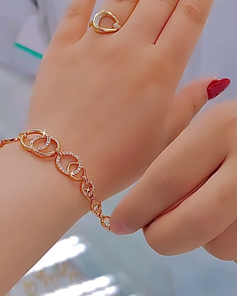 Elegant Rose Gold Tone Jewelry Set with Interlocking Circle Design and Sparkling Accents - Photo 3