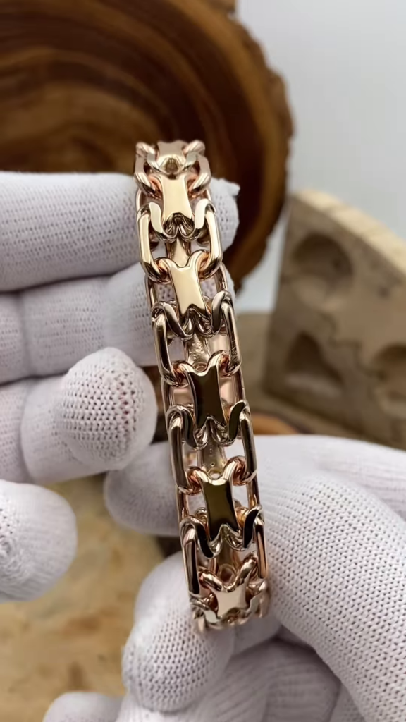Bold Gold-Toned Link Bracelet with Unique Interlocking Design - Photo 1